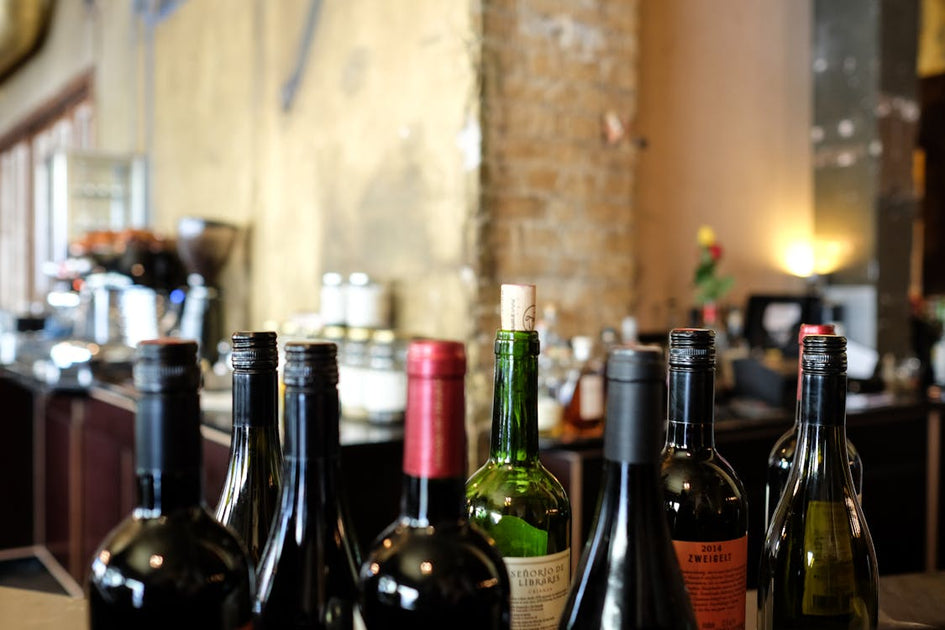 Red wine glass and bottle — resveratrol for skin anti-aging explained beyond the wine marketing