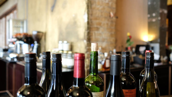 Red wine glass and bottle — resveratrol for skin anti-aging explained beyond the wine marketing